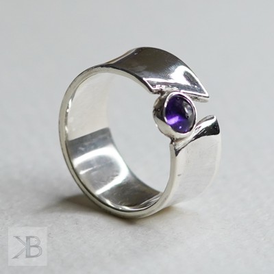 Wide silver band with amethyst